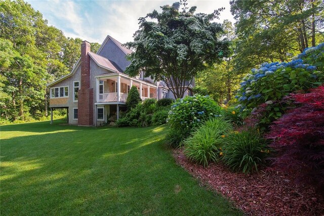 27 Tom Harvey Rd, Westerly, RI 02891 - view of home's exterior with a chimney and a lawn