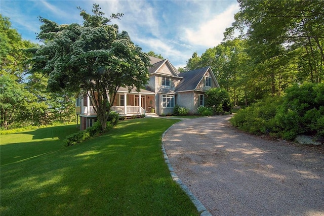27 Tom Harvey Rd, Westerly, RI 02891 - view of front of house with covered porch, a front yard, and driveway