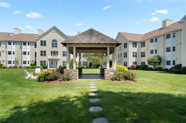 view of home's community featuring a lawn and a gazebo