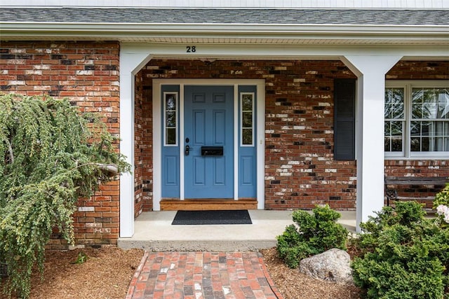 28 Potter Hill Rd, Westerly, RI 02891 - property entrance with brick siding and roof with shingles