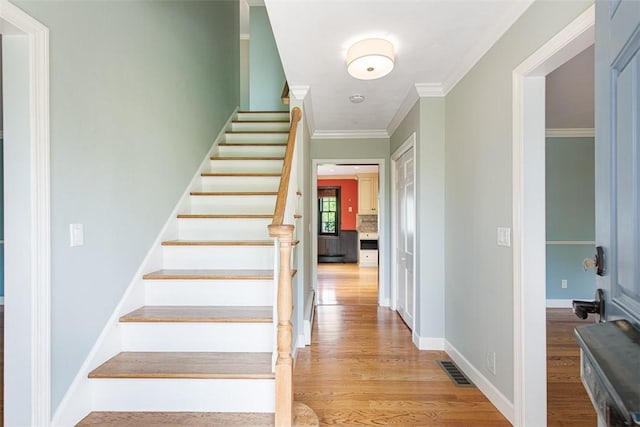 28 Potter Hill Rd, Westerly, RI 02891 - stairs with wood finished floors, crown molding, and baseboards