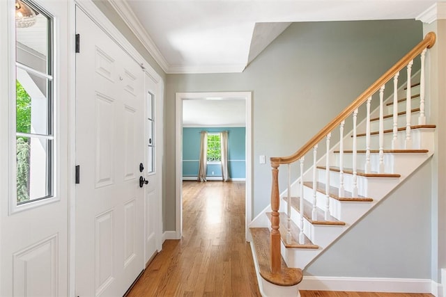 28 Potter Hill Rd, Westerly, RI 02891 - entrance foyer with ornamental molding, wood finished floors, baseboards, and stairs
