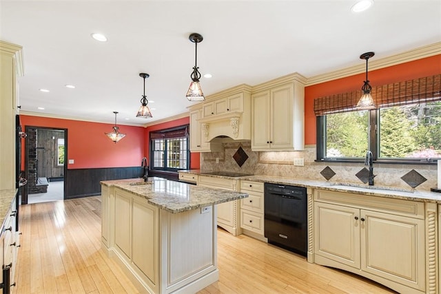 28 Potter Hill Rd, Westerly, RI 02891 - kitchen with cream cabinetry, black appliances, wainscoting, a sink, and healthy amount of natural light