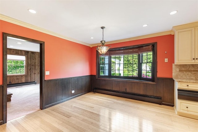 28 Potter Hill Rd, Westerly, RI 02891 - unfurnished dining area featuring a baseboard radiator, light wood-style flooring, wainscoting, wood walls, and recessed lighting