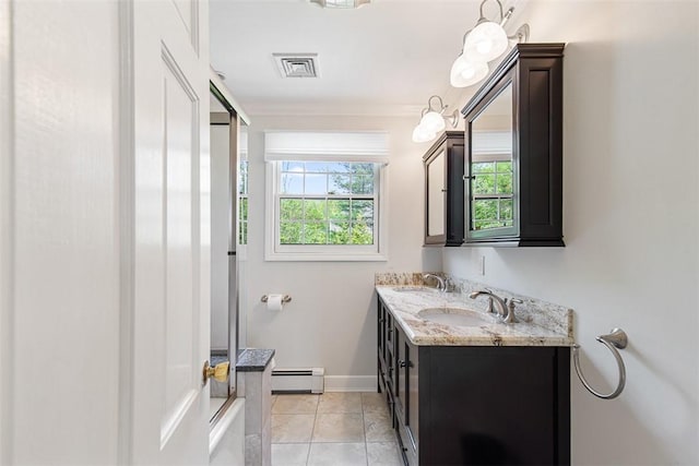 28 Potter Hill Rd, Westerly, RI 02891 - bathroom featuring a baseboard radiator, double vanity, ornamental molding, tile patterned floors, and baseboards