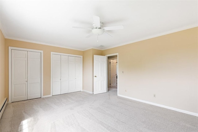 28 Potter Hill Rd, Westerly, RI 02891 - unfurnished bedroom featuring baseboards, multiple closets, light colored carpet, ornamental molding, and a ceiling fan
