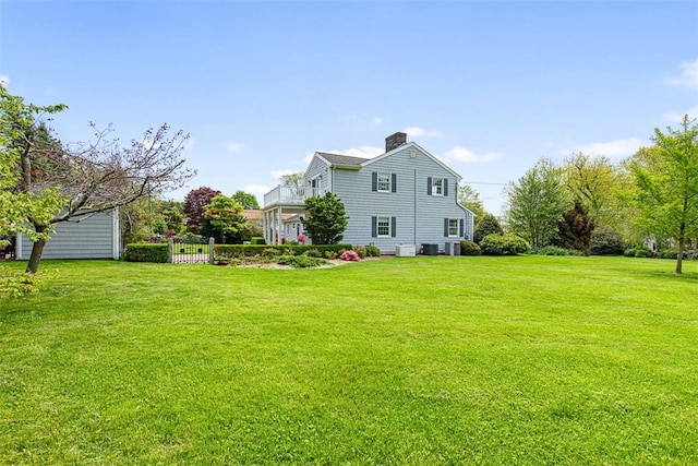 28 Potter Hill Rd, Westerly, RI 02891 - view of home's exterior featuring a yard, a chimney, and central air condition unit