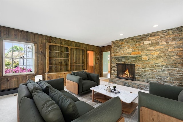 28 Potter Hill Rd, Westerly, RI 02891 - carpeted living room with wood walls and a fireplace