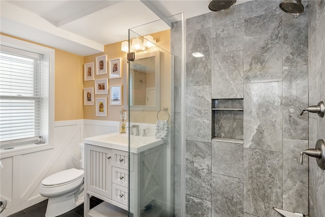 6 Macalder St, Narragansett, RI 02882 - bathroom featuring vanity, a wainscoted wall, toilet, and tiled shower