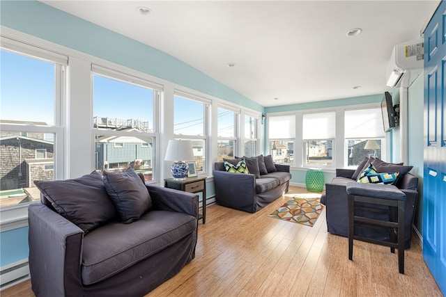 6 Macalder St, Narragansett, RI 02882 - sunroom / solarium with wood finished floors, a wall mounted air conditioner, lofted ceiling, and a baseboard heating unit