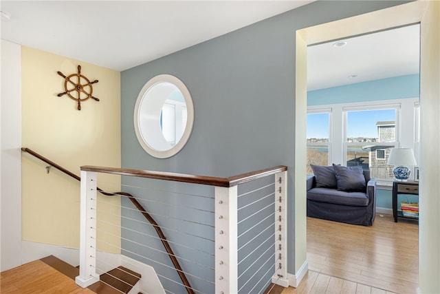 staircase with wood finished floors
