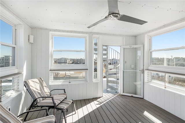 sunroom with a ceiling fan