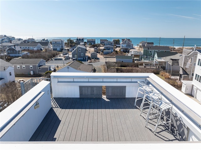 deck with a water view and a residential view