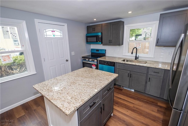 2 King St, Johnston, RI 02919 - kitchen featuring a healthy amount of sunlight, stainless steel appliances, dark wood finished floors, and a sink
