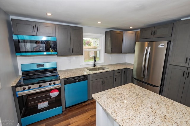 2 King St, Johnston, RI 02919 - kitchen featuring a sink, stainless steel appliances, dark wood finished floors, backsplash, and light stone countertops