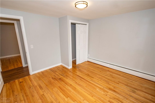 2 King St, Johnston, RI 02919 - interior space featuring baseboards, light wood-type flooring, and a baseboard heating unit