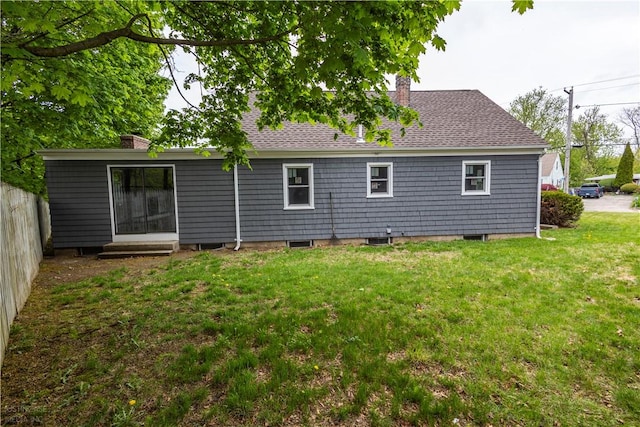 2 King St, Johnston, RI 02919 - rear view of property featuring a yard, roof with shingles, fence, and a chimney