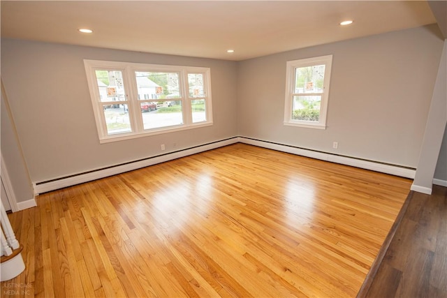 2 King St, Johnston, RI 02919 - unfurnished room with a baseboard radiator, baseboard heating, recessed lighting, baseboards, and wood finished floors