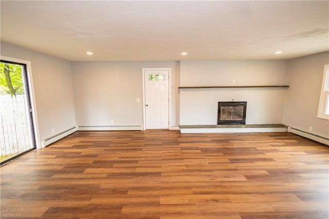2 King St, Johnston, RI 02919 - unfurnished living room with wood finished floors, a glass covered fireplace, and recessed lighting
