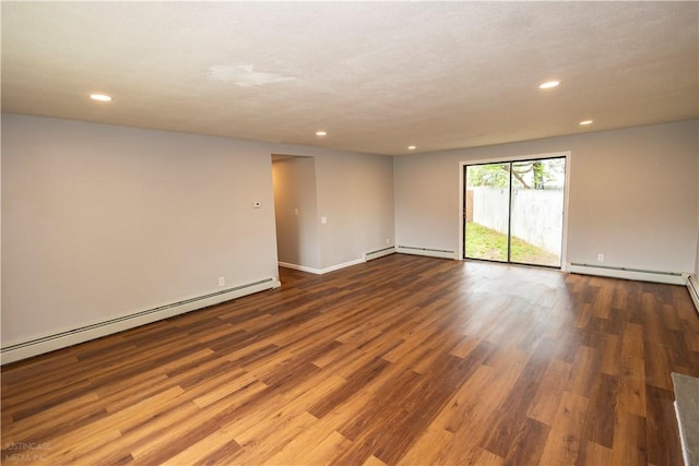 2 King St, Johnston, RI 02919 - empty room featuring recessed lighting, wood finished floors, baseboards, and a baseboard heating unit