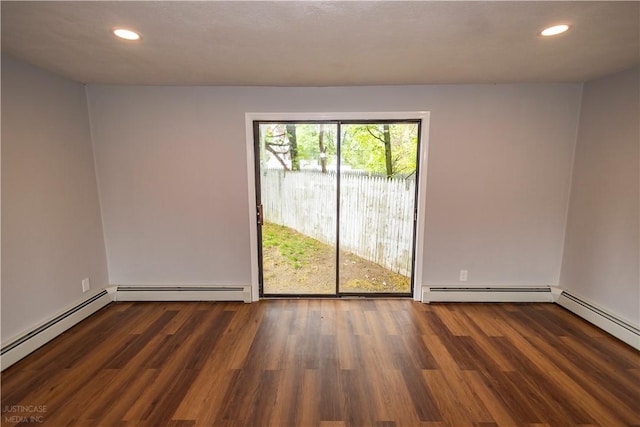 2 King St, Johnston, RI 02919 - spare room with wood finished floors, baseboard heating, and recessed lighting