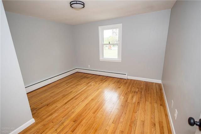 2 King St, Johnston, RI 02919 - unfurnished room featuring a baseboard radiator, hardwood / wood-style flooring, and baseboards