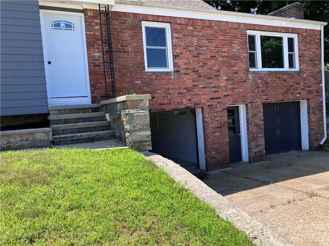 2 King St, Johnston, RI 02919 - view of front of property with entry steps, brick siding, roof with shingles, and a garage