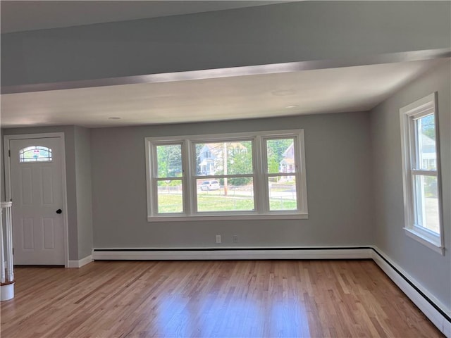 2 King St, Johnston, RI 02919 - foyer with baseboard heating, healthy amount of natural light, and light wood-style flooring