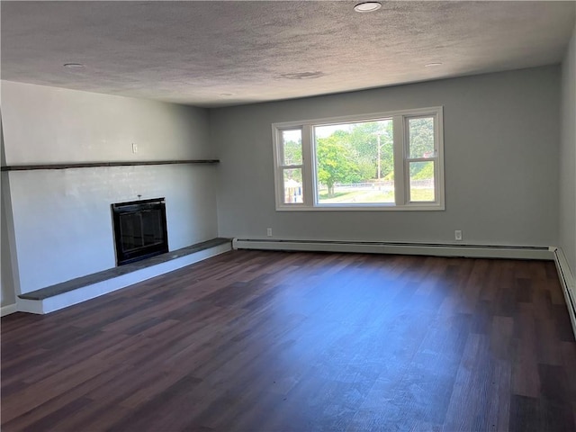 2 King St, Johnston, RI 02919 - unfurnished living room featuring a textured ceiling, a glass covered fireplace, dark wood finished floors, baseboard heating, and recessed lighting