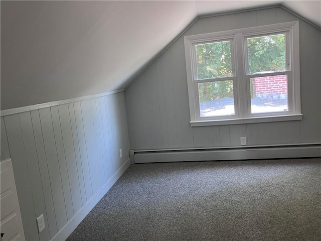 2 King St, Johnston, RI 02919 - additional living space with carpet floors, baseboard heating, vaulted ceiling, and a decorative wall