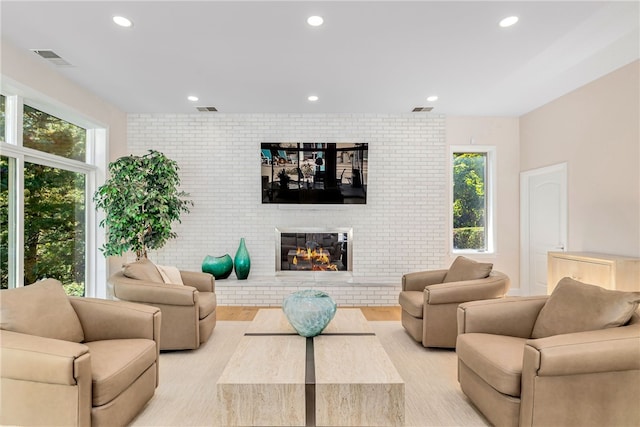 living room with visible vents, a healthy amount of sunlight, and recessed lighting