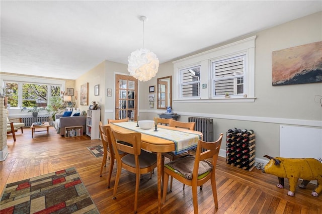 80 Wilcox Ave, Pawtucket, RI 02860 - dining room with an inviting chandelier, hardwood / wood-style flooring, and radiator