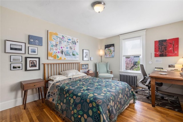 80 Wilcox Ave, Pawtucket, RI 02860 - bedroom with wood finished floors, baseboards, and radiator heating unit