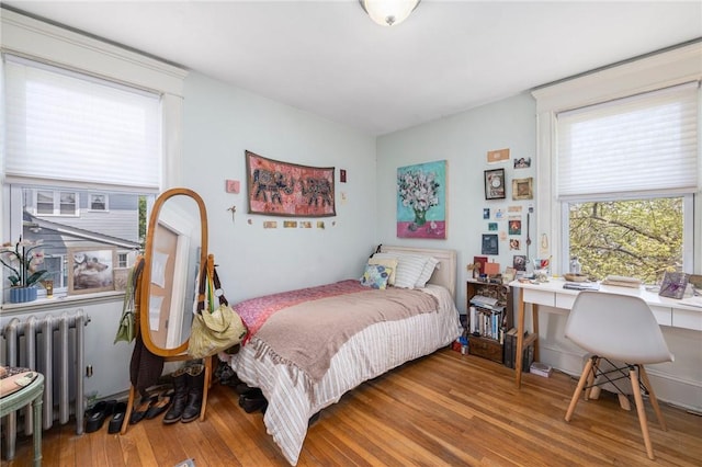 80 Wilcox Ave, Pawtucket, RI 02860 - bedroom featuring radiator heating unit and wood finished floors