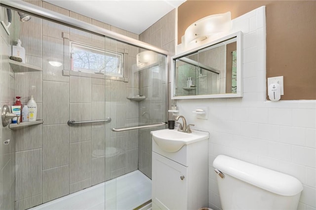 80 Wilcox Ave, Pawtucket, RI 02860 - bathroom featuring vanity, toilet, tile walls, and a shower stall