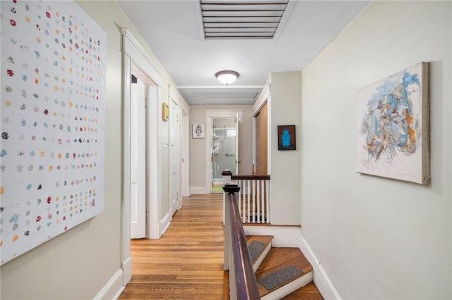 80 Wilcox Ave, Pawtucket, RI 02860 - hall with baseboards, light wood finished floors, an upstairs landing, and visible vents