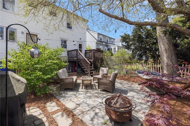 80 Wilcox Ave, Pawtucket, RI 02860 - view of patio with fence, a grill, a fire pit, stairway, and a wooden deck