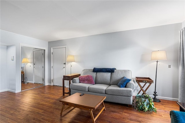 living area with wood finished floors and baseboards