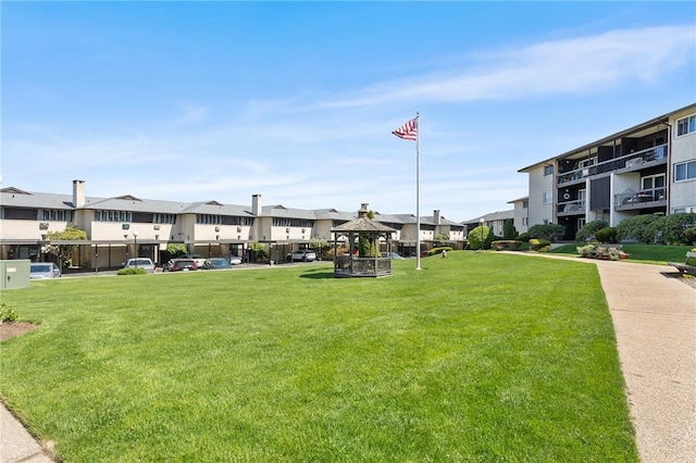 surrounding community with a yard, a residential view, and a gazebo