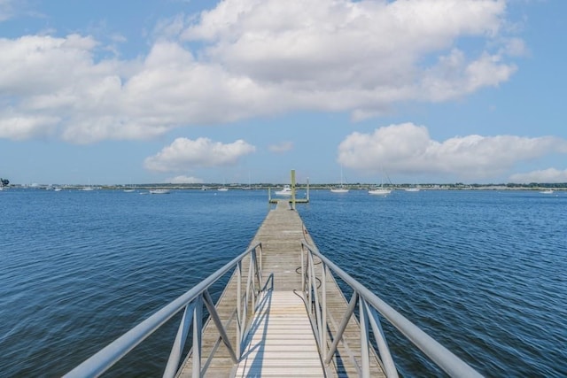 dock area with a water view and a residential view