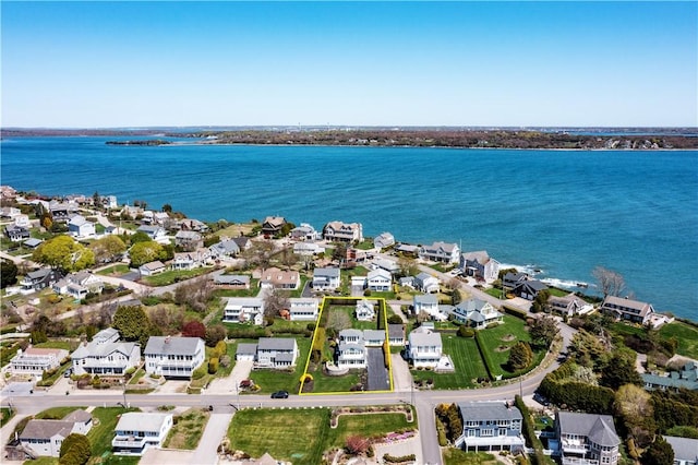 view of property location with nearby suburban area and a nearby body of water