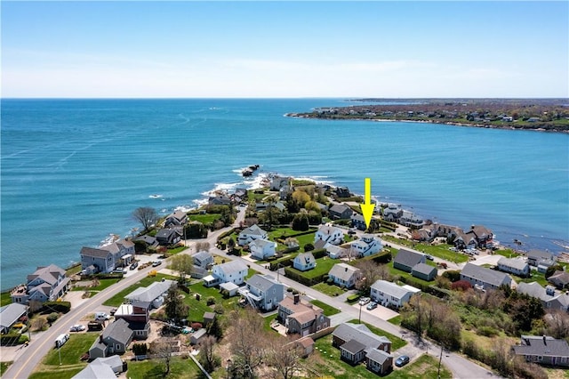 aerial perspective of suburban area featuring a nearby body of water