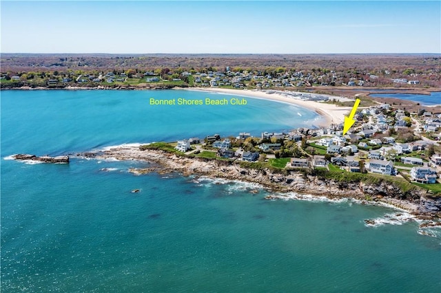 aerial view of residential area with a nearby body of water