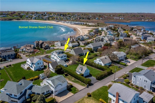 aerial perspective of suburban area featuring a nearby body of water
