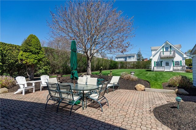 view of patio / terrace featuring outdoor dining area and a balcony
