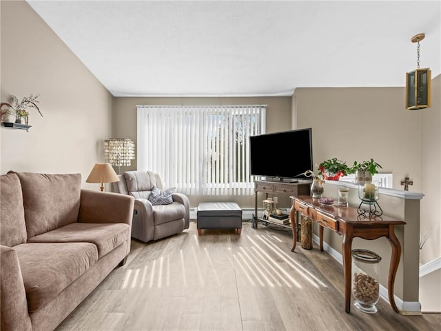 132 Elton Cir, Cranston, RI 02921 - living room with baseboards, baseboard heating, and wood finished floors