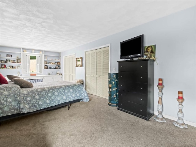 132 Elton Cir, Cranston, RI 02921 - bedroom with two closets, a textured ceiling, carpet, and baseboards