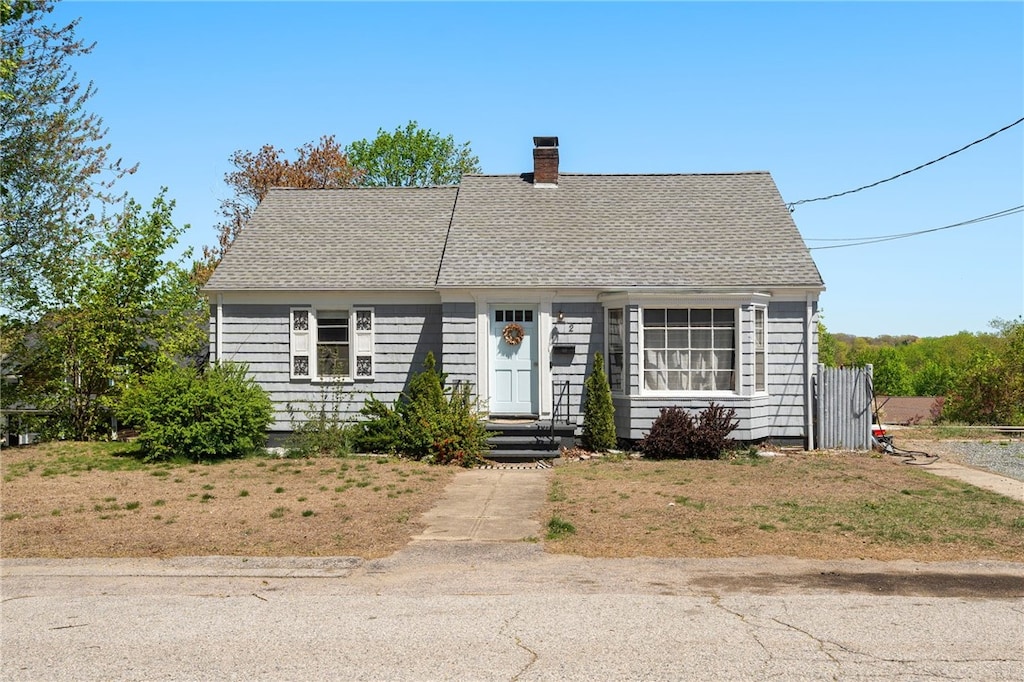 2 Notre Dame St, Coventry, RI 02816 - cape cod house featuring a chimney and roof with shingles