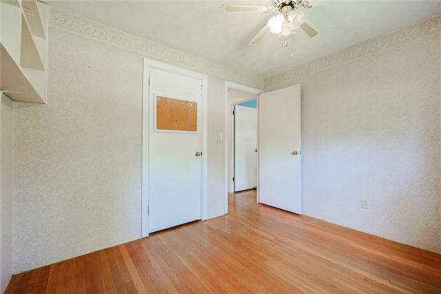 unfurnished bedroom featuring ceiling fan and light wood-type flooring