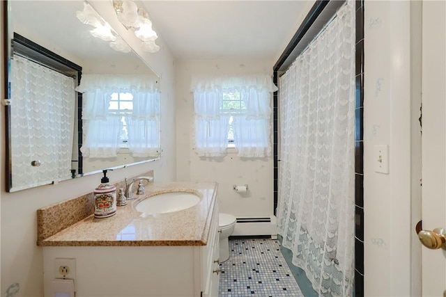 full bath with toilet, a wealth of natural light, a baseboard radiator, and vanity
